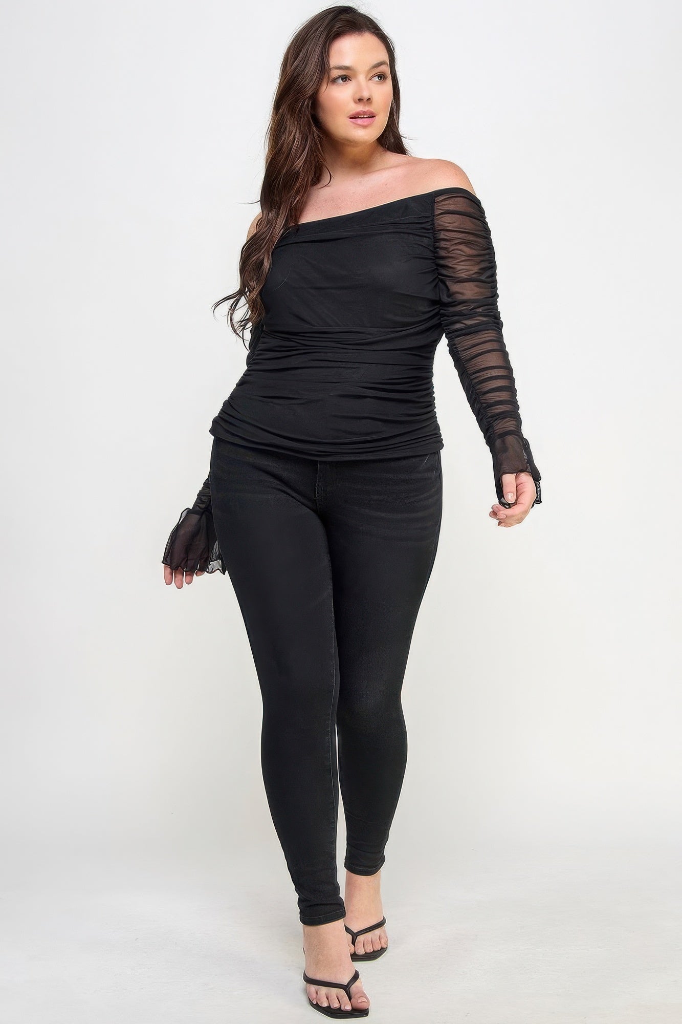Ots Ruched Mesh Top featuring off-the-shoulder design and sheer ruched long sleeves in classic black color.
