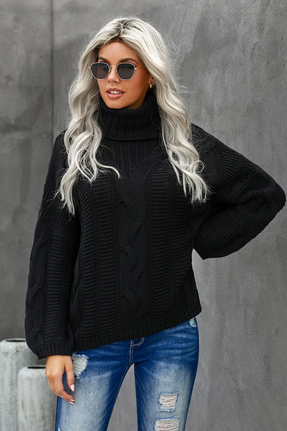 A cozy Oversize Turtleneck Textured Sweater featuring a chunky knit design, drop shoulder fit, and elegant turtleneck, perfect for winter styling.