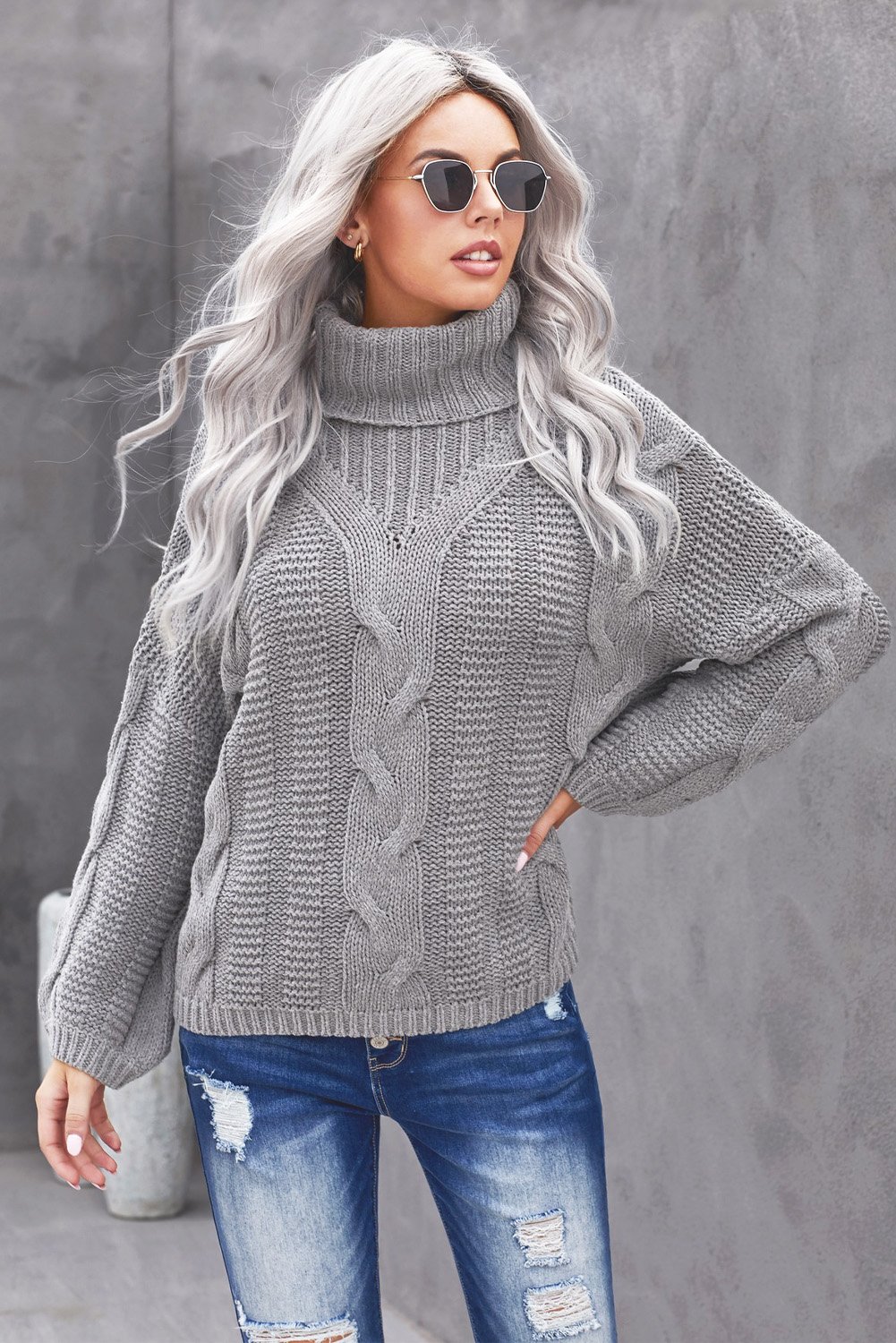 A cozy Oversize Turtleneck Textured Sweater featuring a chunky knit design, drop shoulder fit, and elegant turtleneck, perfect for winter styling.
