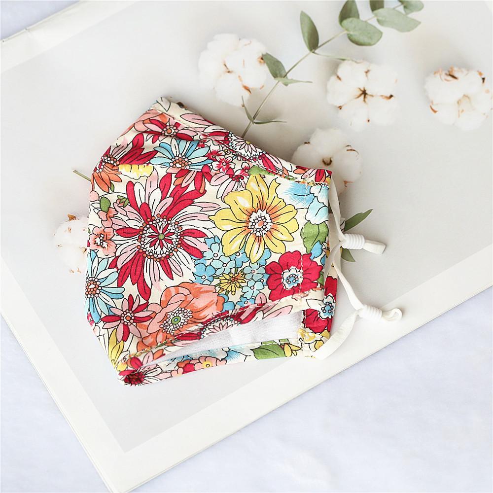 Pack of 4 adult cotton face masks in various prints, featuring a nose wire and soft elastic ear loops for comfort.