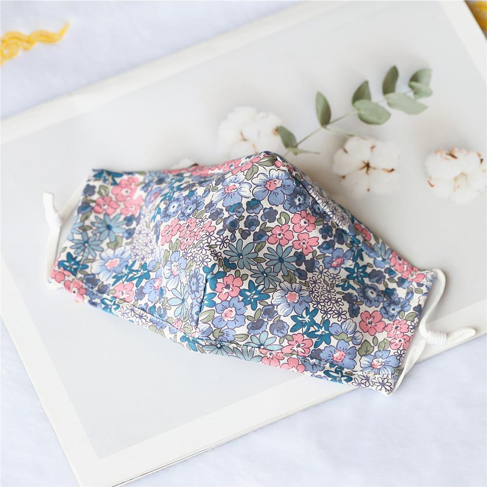 Pack of 4 adult cotton face masks in various prints, featuring a nose wire and soft elastic ear loops for comfort.