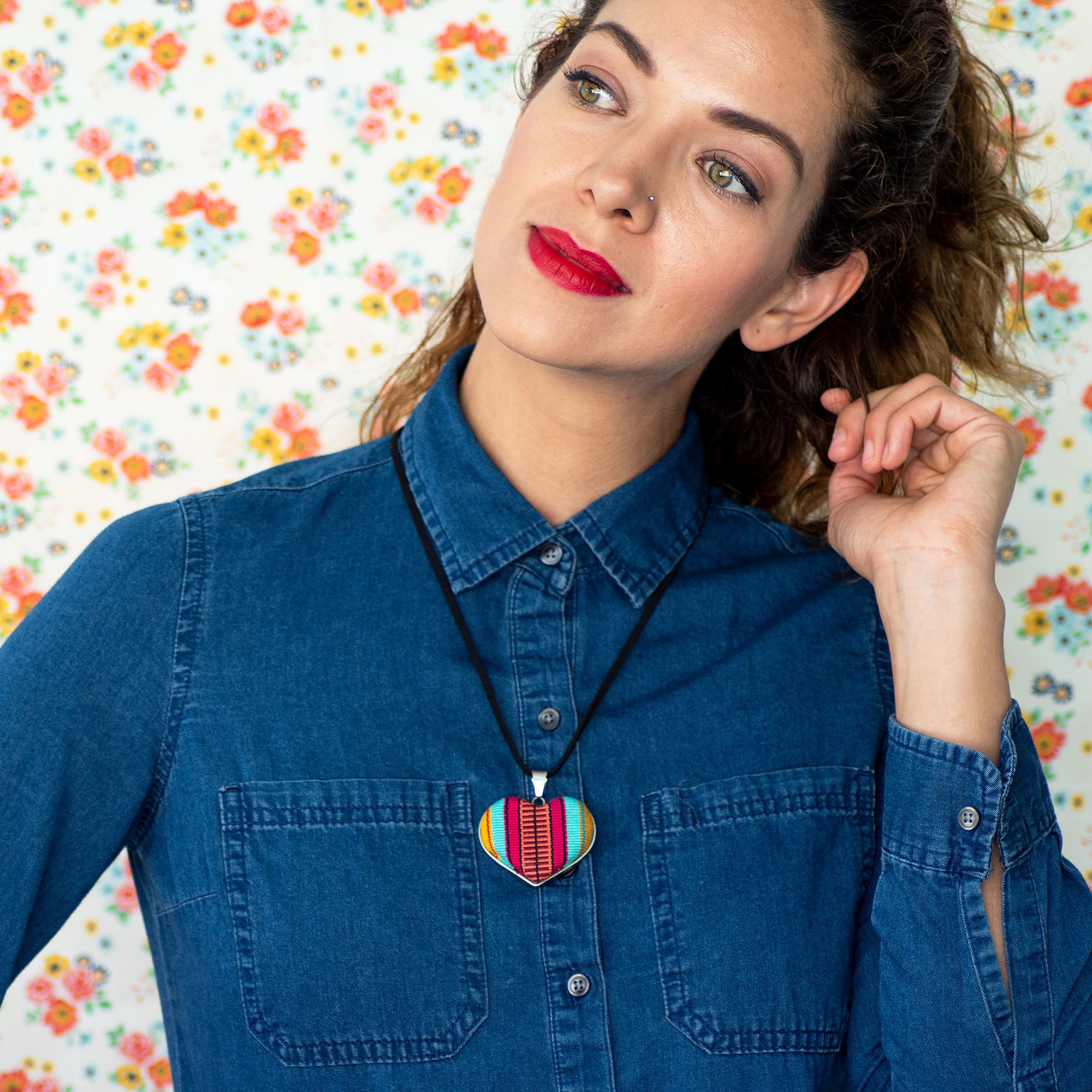 Colorful Panthelo Heart Textile Necklace featuring a unique heart-shaped pendant made from cotton loom, suspended on a leather string.