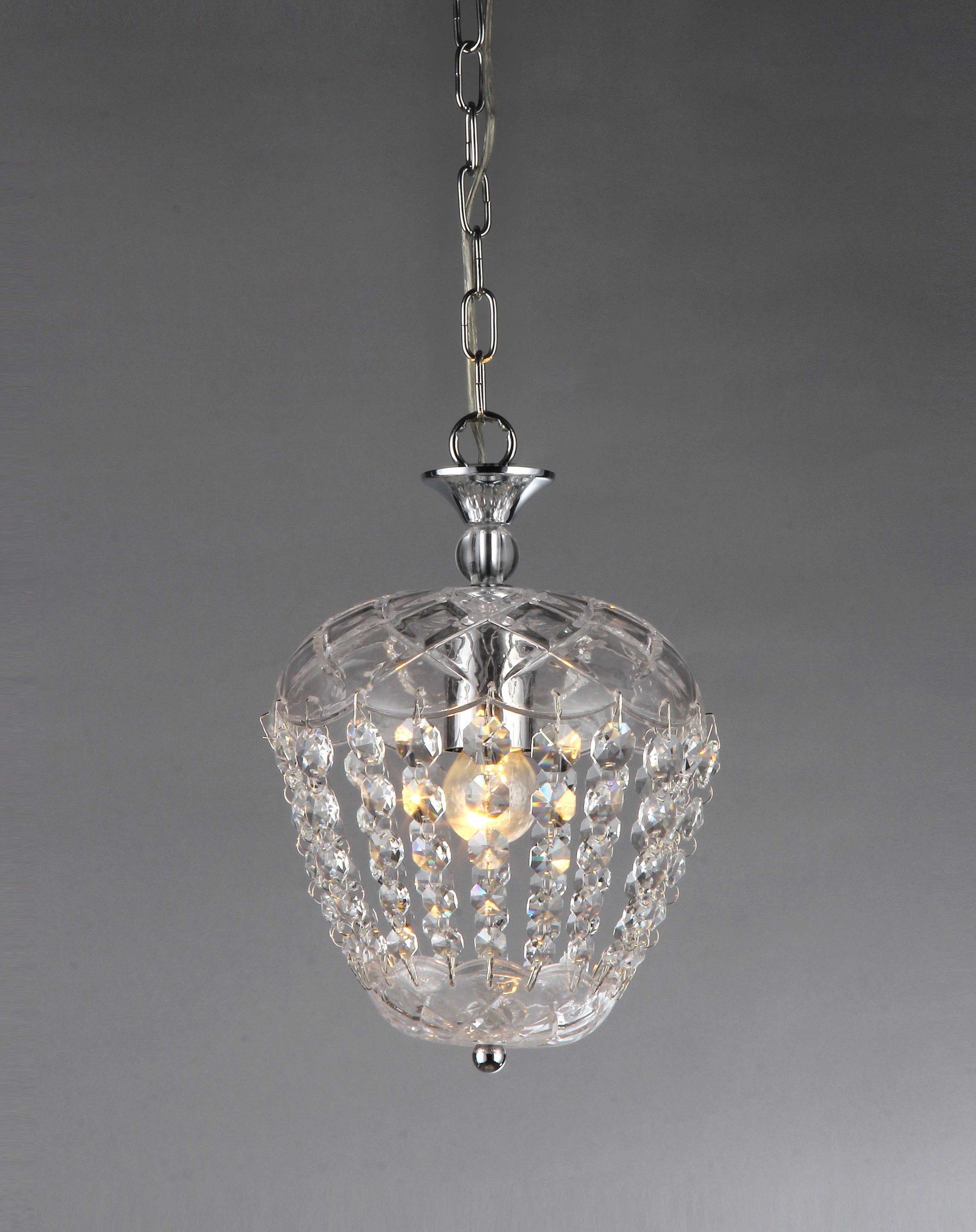 A stunning Paris Crystal Chandelier featuring sleek chrome details and sparkling faceted clear crystals, illuminating a stylish interior.