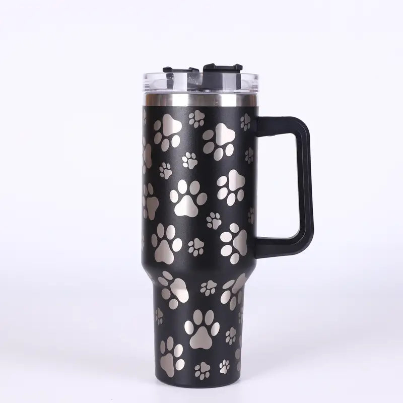A 40oz stainless steel tumbler with a paw pattern design, featuring a lid and handle, ideal for hot and cold beverages.