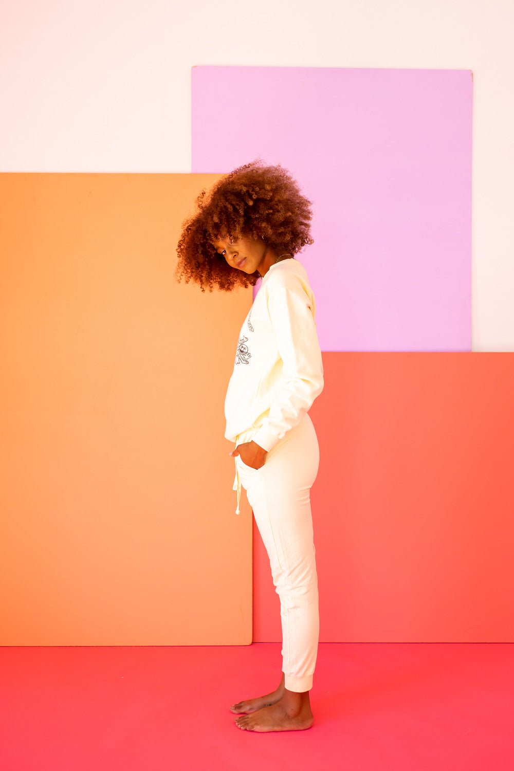 Ivory Peace Love and Sesame Sweatshirt made from 100% upcycled cotton, featuring a playful design that embodies love and peace.