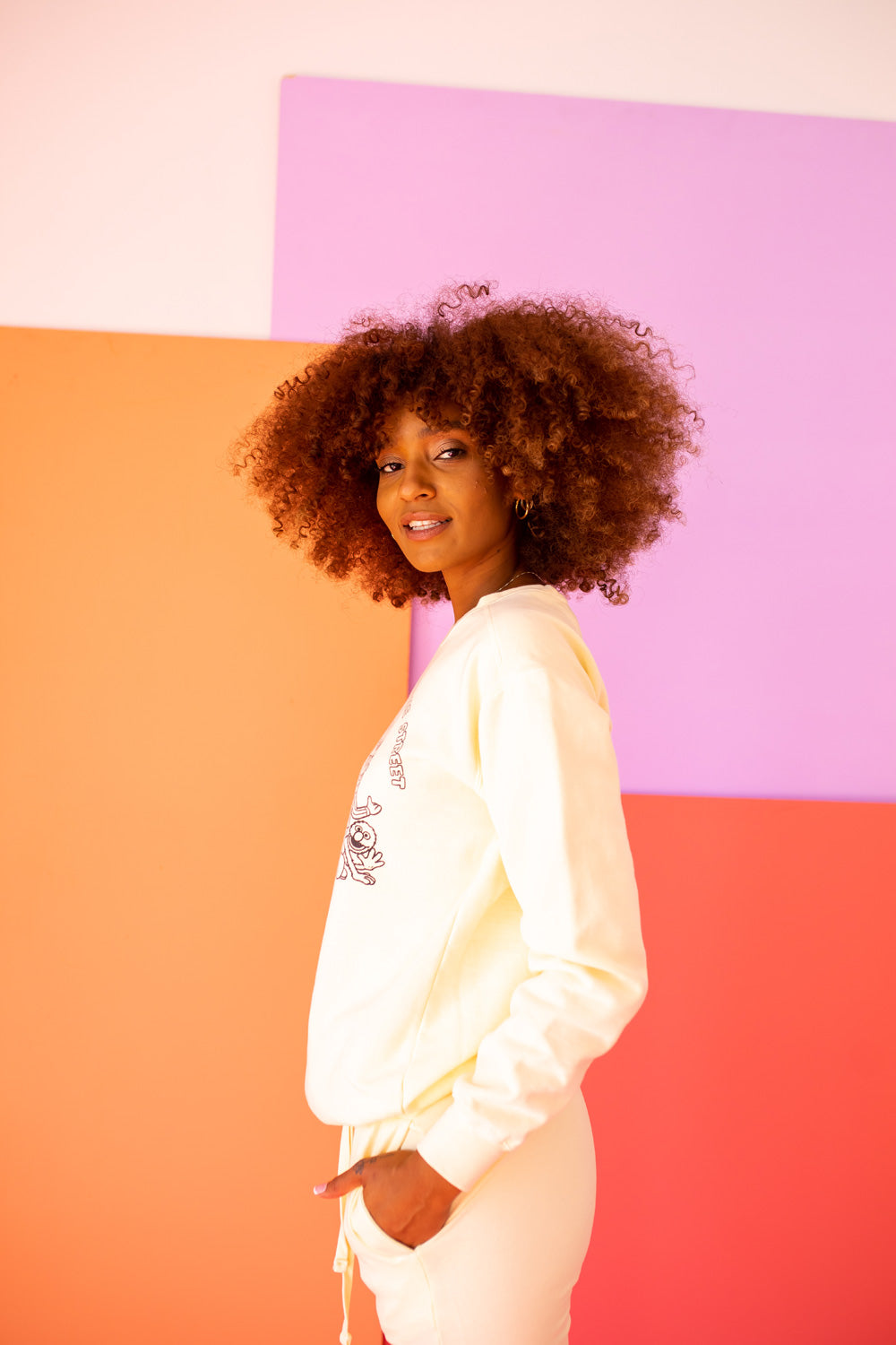 Ivory Peace Love and Sesame Sweatshirt made from 100% upcycled cotton, featuring a playful design that embodies love and peace.