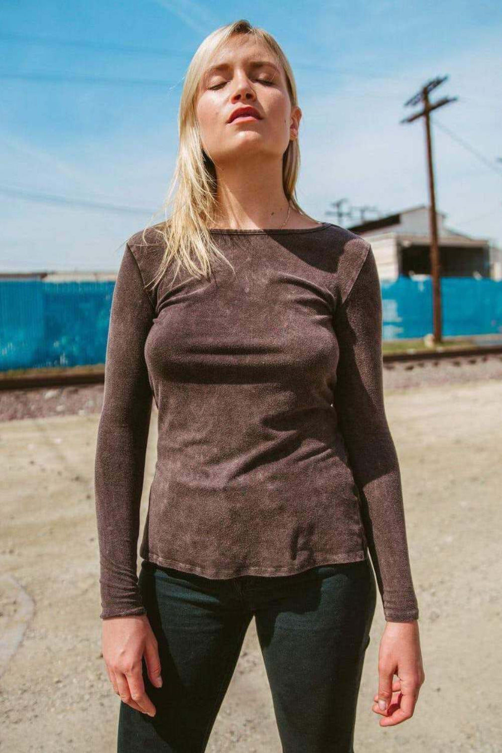 A stylish brown Peekaboo Wrap Top featuring an open back and criss-cross design, made from soft bamboo cotton blend.
