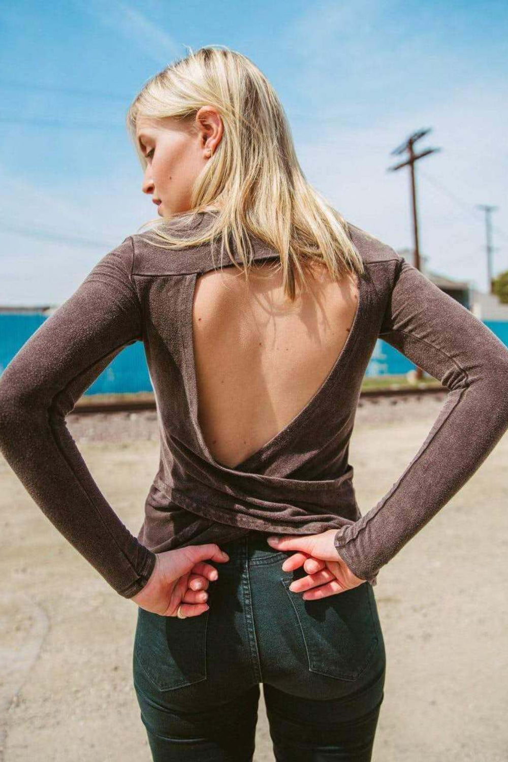 A stylish brown Peekaboo Wrap Top featuring an open back and criss-cross design, made from soft bamboo cotton blend.