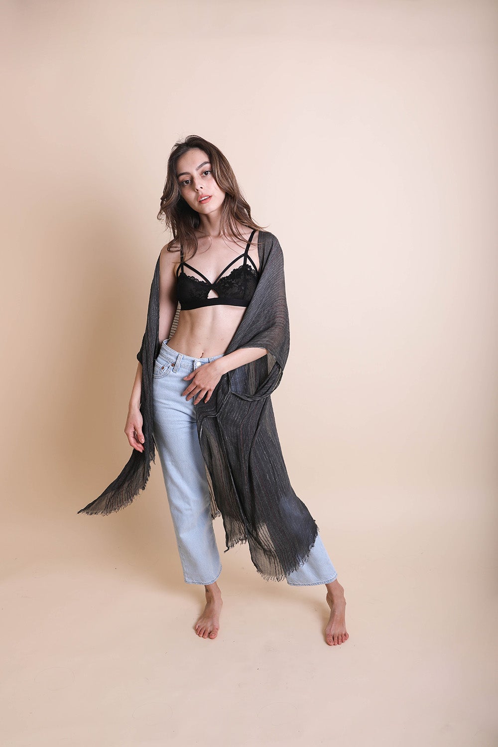 A stylish Pencil Stripe Lurex Trim Kimono featuring a chic pencil stripe pattern and elegant lurex trim, perfect for summer outings.