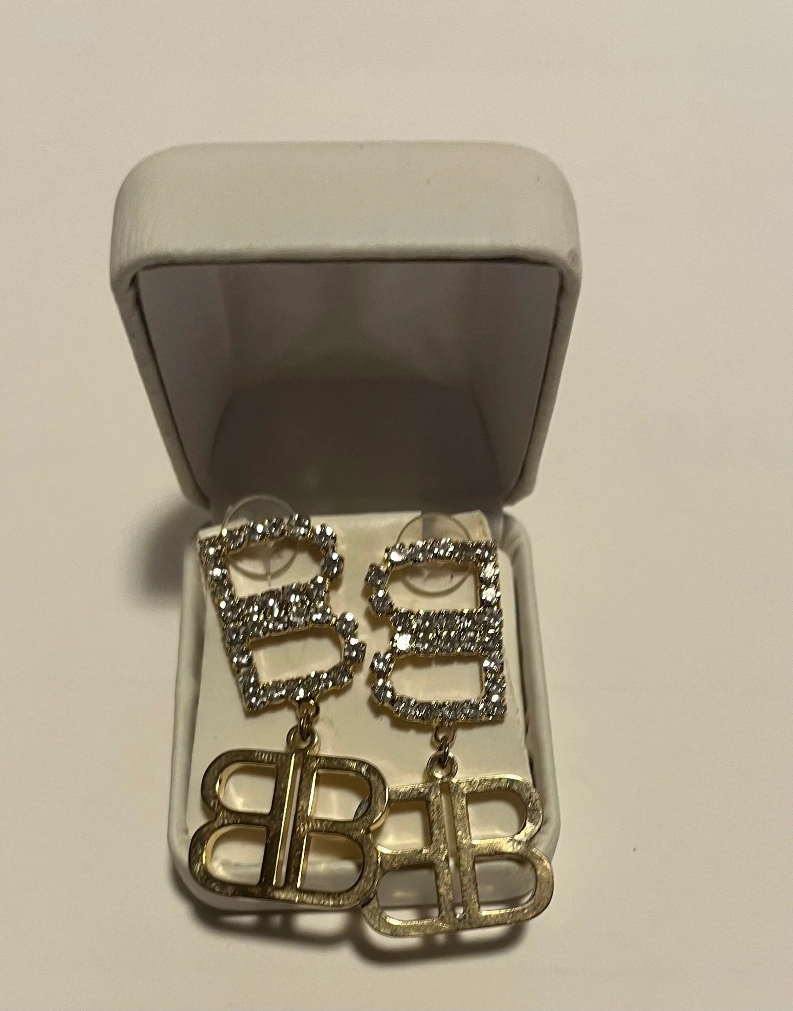 Elegant gold Pendant Lux Earrings by Balenciaga, featuring a stylish design and high-quality craftsmanship.