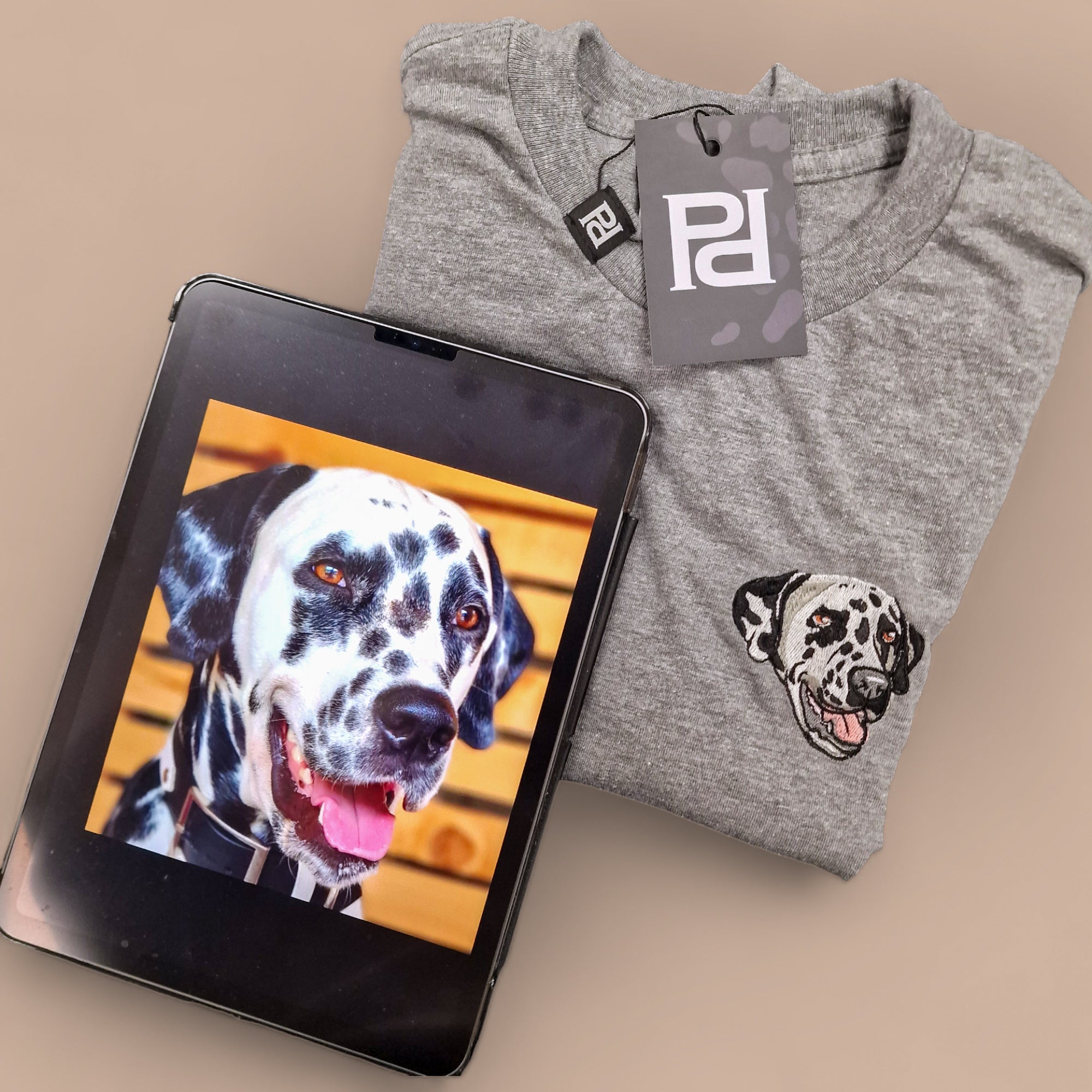 Custom embroidered T-shirt featuring a pet portrait of a dog, showcasing vibrant colors and detailed stitching.