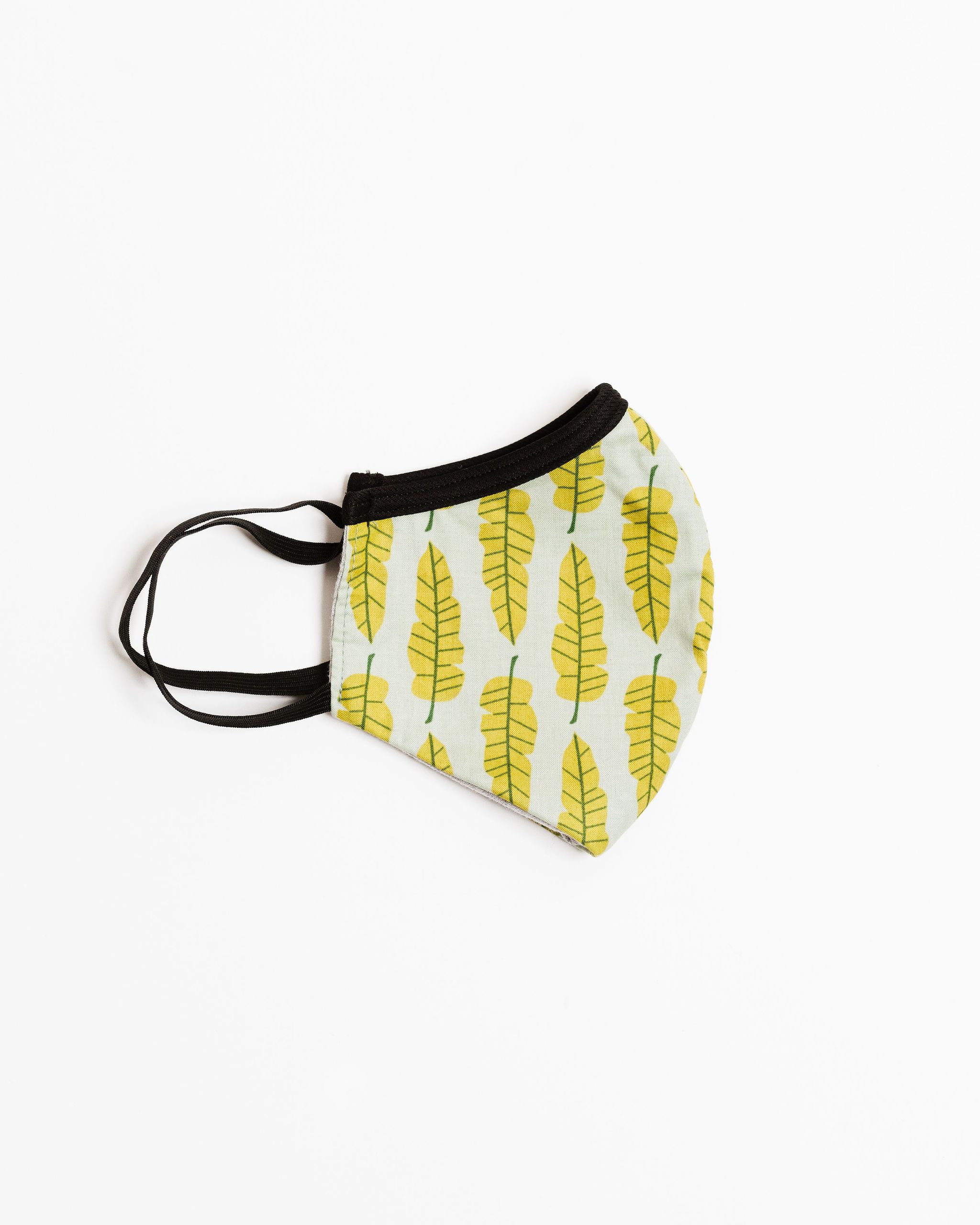 Philodendron Face Mask made of 100% cotton with unique printed designs, featuring elastic straps for a secure fit.
