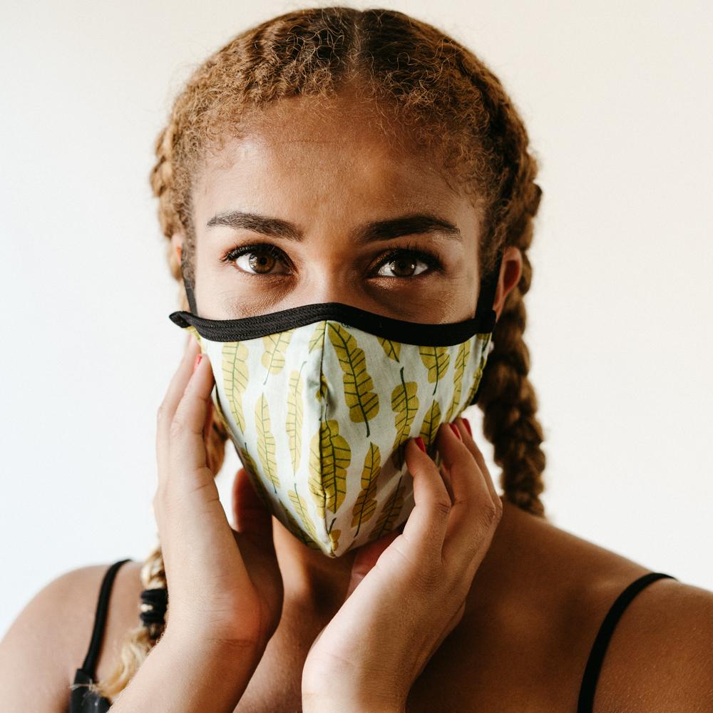 Philodendron Face Mask made of 100% cotton with unique printed designs, featuring elastic straps for a secure fit.