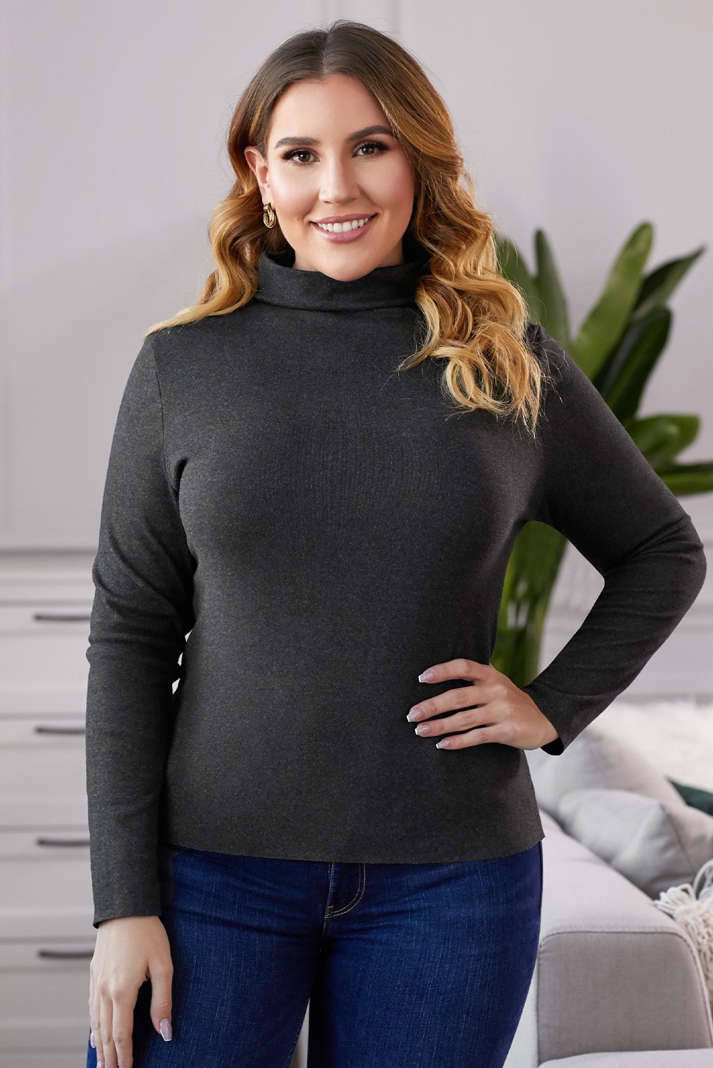 A stylish Plain Turtleneck Ribbed Plus Size Top in a soft fabric, showcasing its elegant design and slim fit, perfect for colder weather.