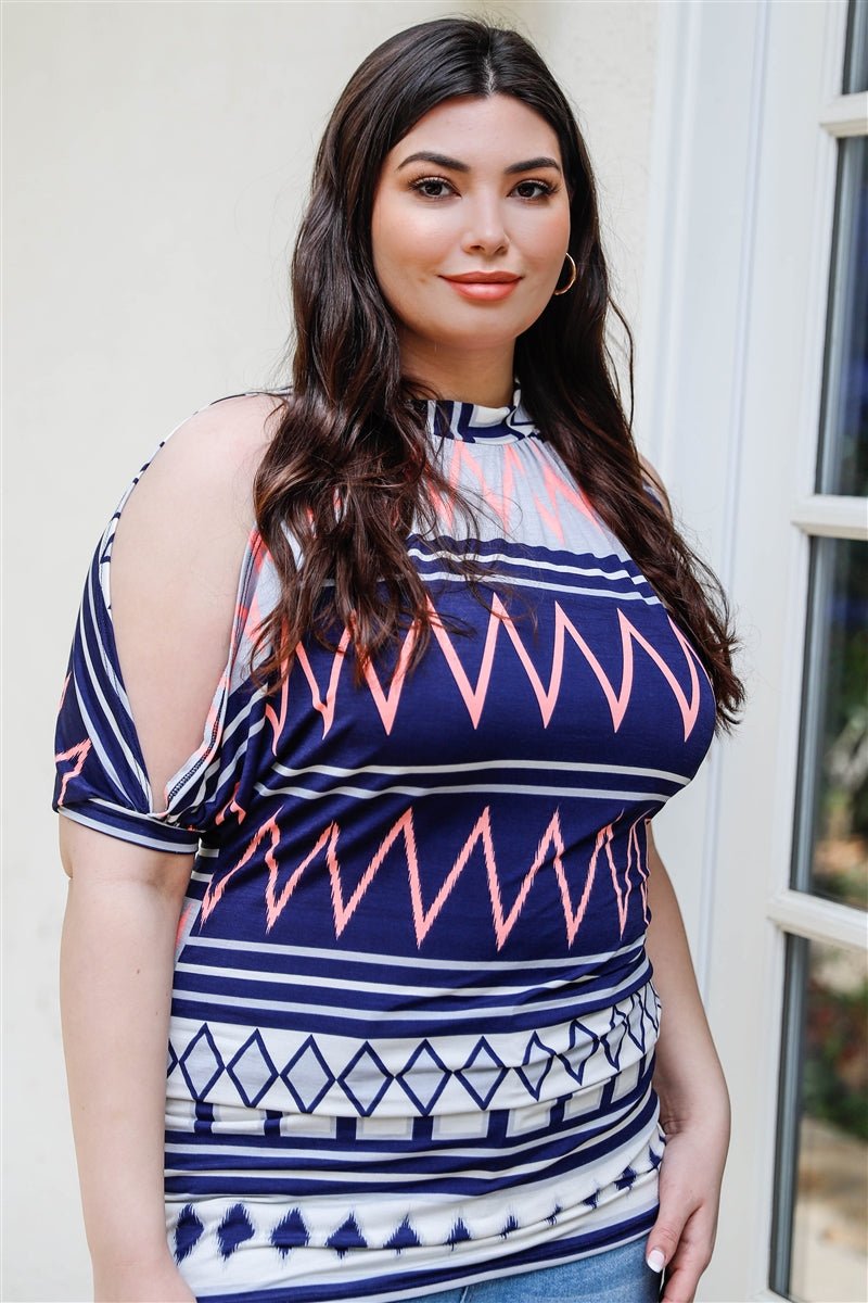 A stylish plus size cold shoulder top featuring a navy polka dot print, short cuffed sleeves, and a back self-tie detail, perfect for casual outings.