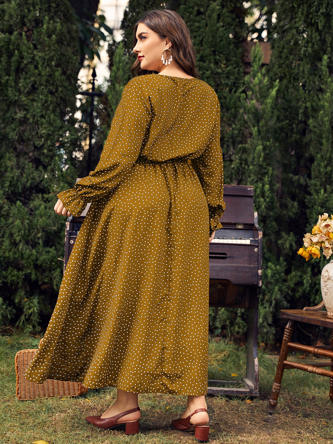 A stylish plus size ruffled polka dot long sleeve midi dress, featuring a playful polka dot pattern and elegant ruffles, perfect for any occasion.
