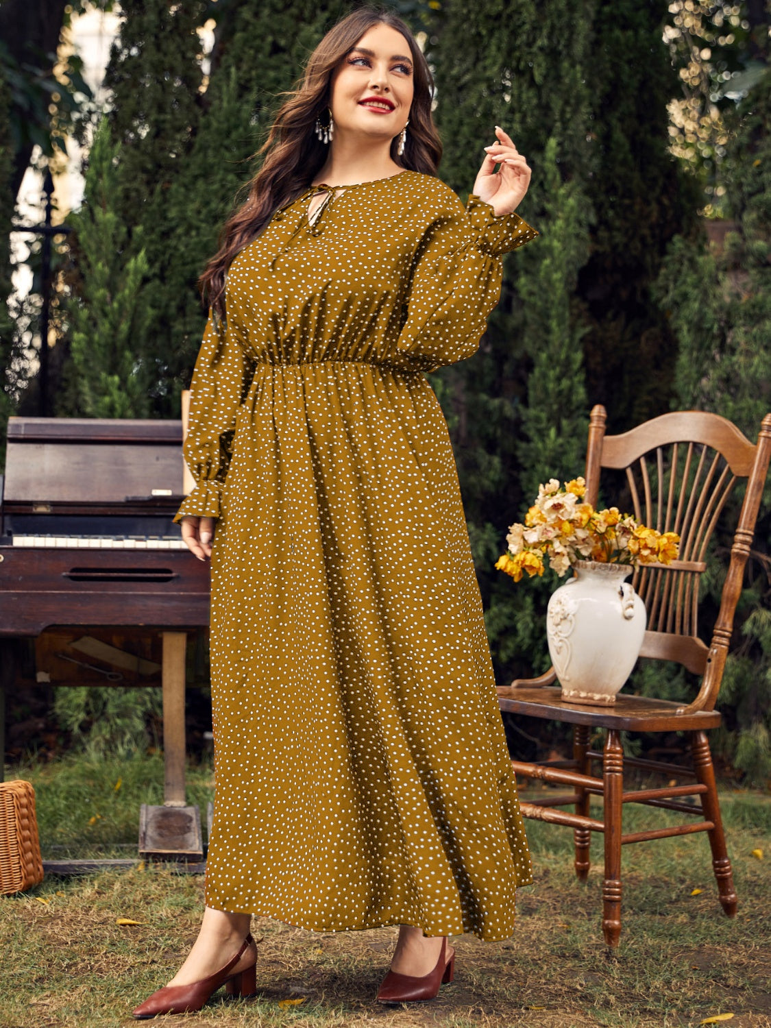 A stylish plus size ruffled polka dot long sleeve midi dress, featuring a playful polka dot pattern and elegant ruffles, perfect for any occasion.