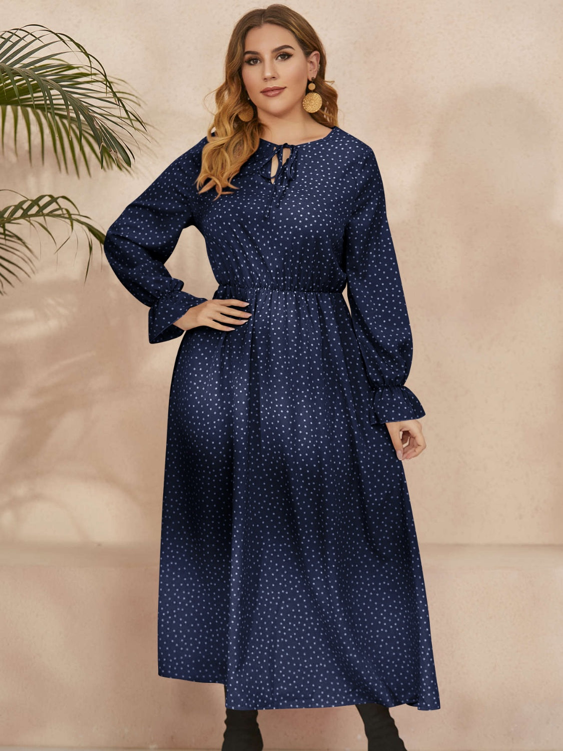 A stylish plus size ruffled polka dot long sleeve midi dress, featuring a playful polka dot pattern and elegant ruffles, perfect for any occasion.