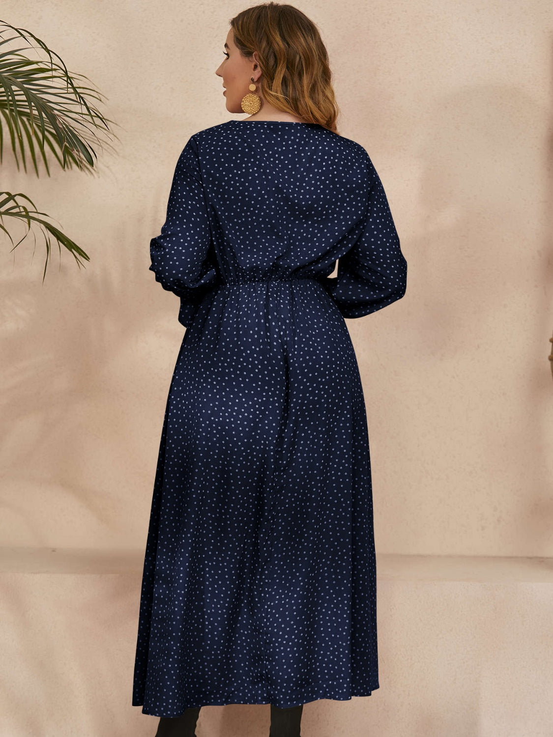 A stylish plus size ruffled polka dot long sleeve midi dress, featuring a playful polka dot pattern and elegant ruffles, perfect for any occasion.