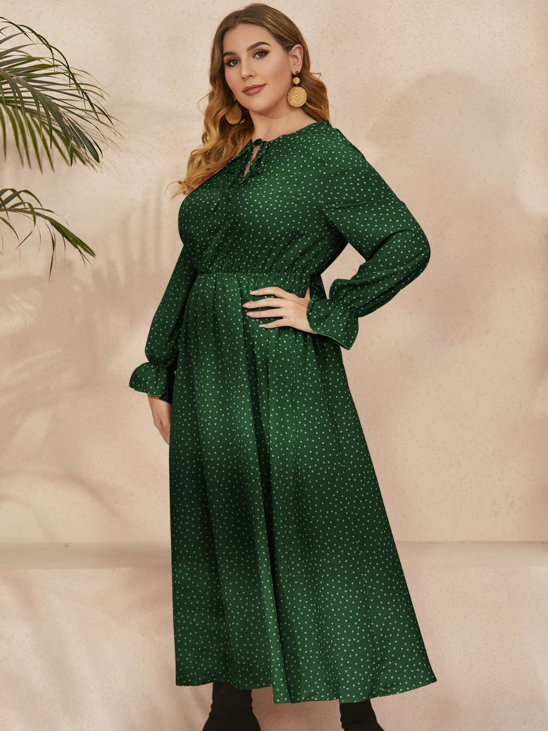 A stylish plus size ruffled polka dot long sleeve midi dress, featuring a playful polka dot pattern and elegant ruffles, perfect for any occasion.