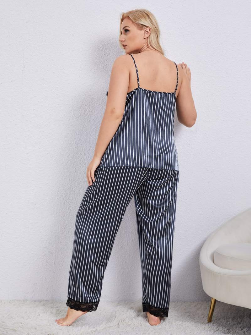 Plus size vertical stripe lace trim cami and pants pajama set displayed on a model, showcasing its elegant design and soft satin material.