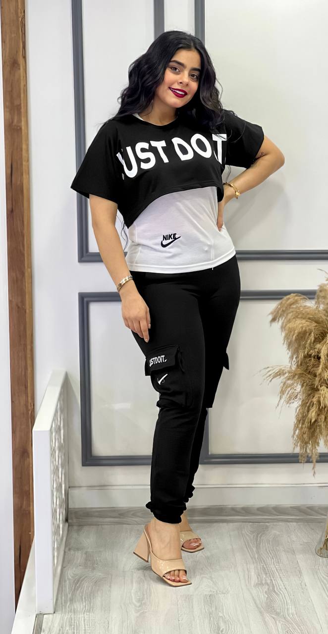 A stylish three-piece matching set featuring a cropped top, white vest, and jogger pants in a coordinated color scheme.