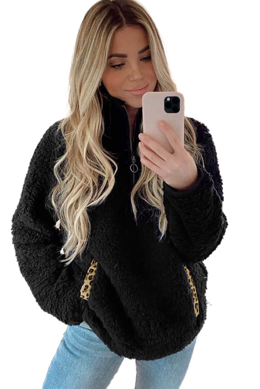 A cozy Pocketed Sherpa Pullover Sweatshirt featuring a half zip collar, long sleeves, and a stylish leopard trim on the pockets.