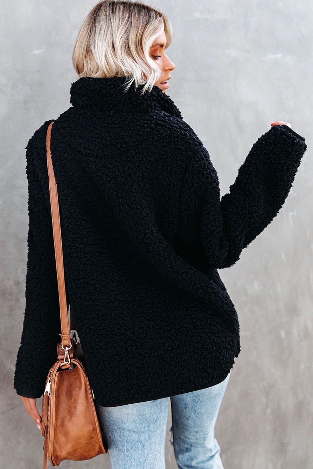 A cozy Pocketed Sherpa Pullover Sweatshirt featuring a half zip collar, long sleeves, and a stylish leopard trim on the pockets.