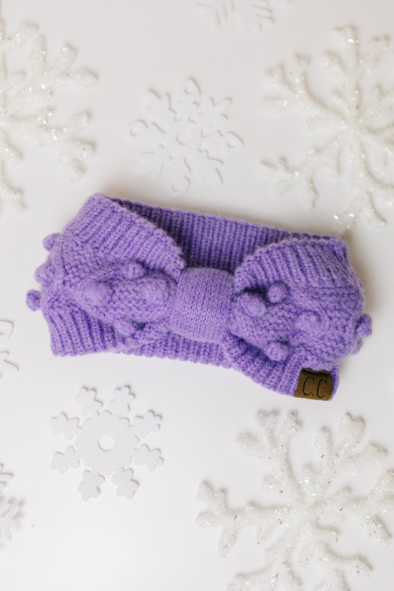 Pom Knit Head Wrap in Periwinkle with handmade baubles, showcasing a soft stretch knit design perfect for winter.