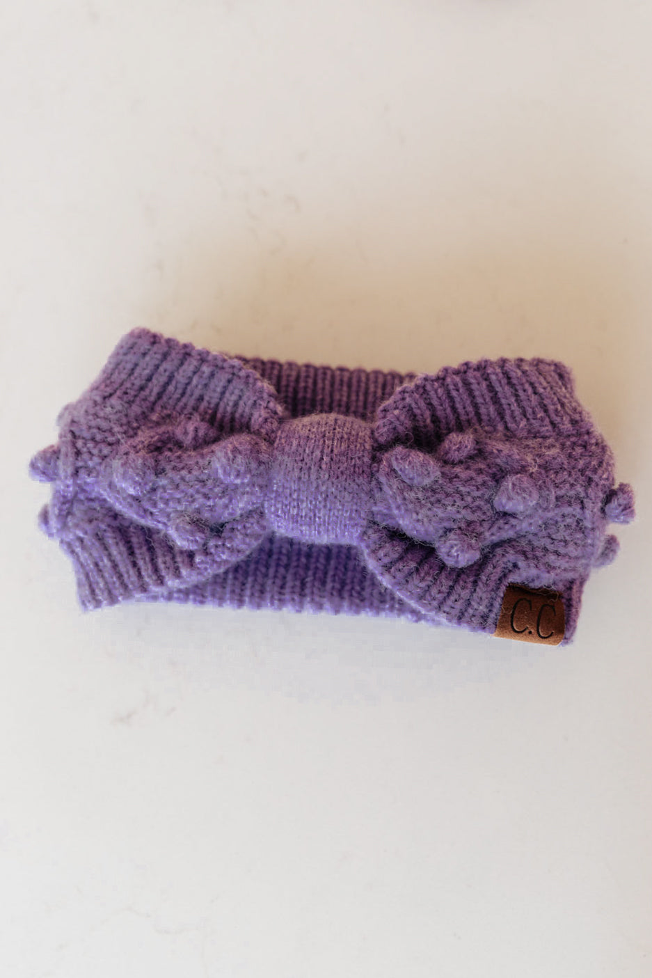 Pom Knit Head Wrap in Periwinkle with handmade baubles, showcasing a soft stretch knit design perfect for winter.