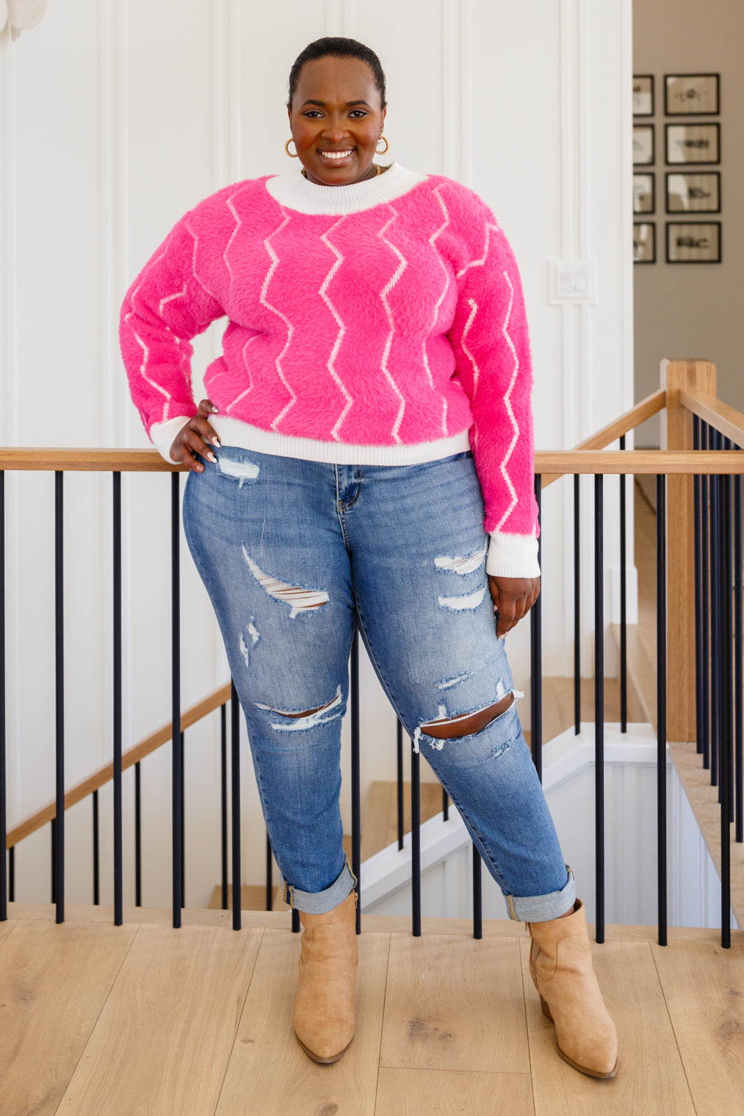 Bright pink Pop Culture Zig Zag Sweater with white collar and cuffs, displayed on a mannequin.