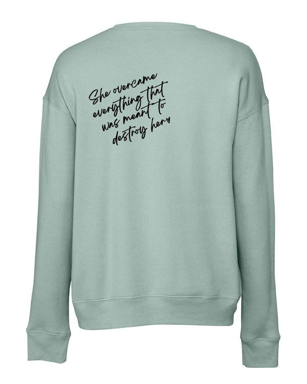 A stylish sweatshirt featuring the empowering phrase 'PowHerful' on the front and 'She Overcame Everything That Was Meant to Destroy Her' on the back.