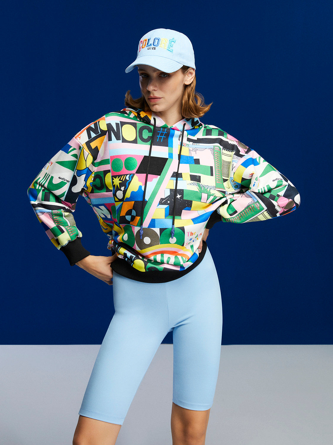 A stylish Print Oversized Sweatshirt featuring a cozy hood, long sleeves, and a relaxed fit, perfect for casual wear.