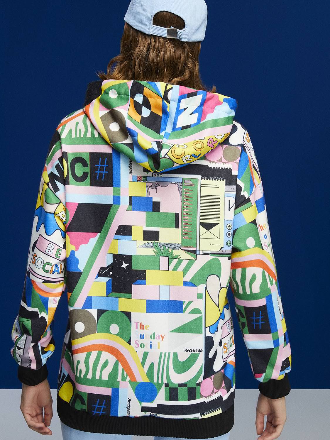 A stylish Print Oversized Sweatshirt featuring a cozy hood, long sleeves, and a relaxed fit, perfect for casual wear.