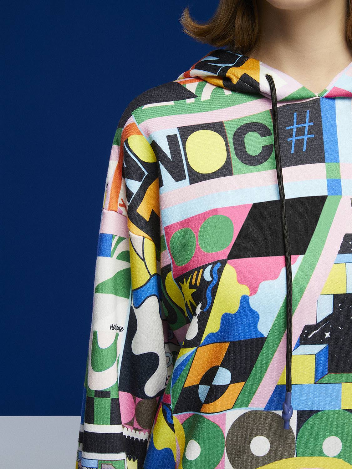 A stylish Print Oversized Sweatshirt featuring a cozy hood, long sleeves, and a relaxed fit, perfect for casual wear.