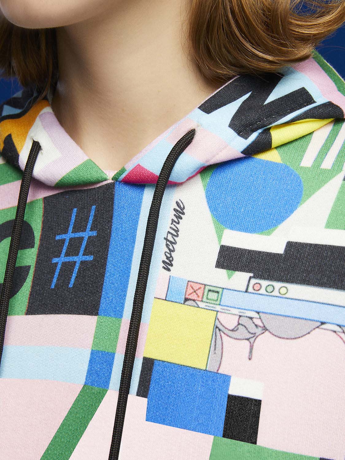 A stylish Print Oversized Sweatshirt featuring a cozy hood, long sleeves, and a relaxed fit, perfect for casual wear.