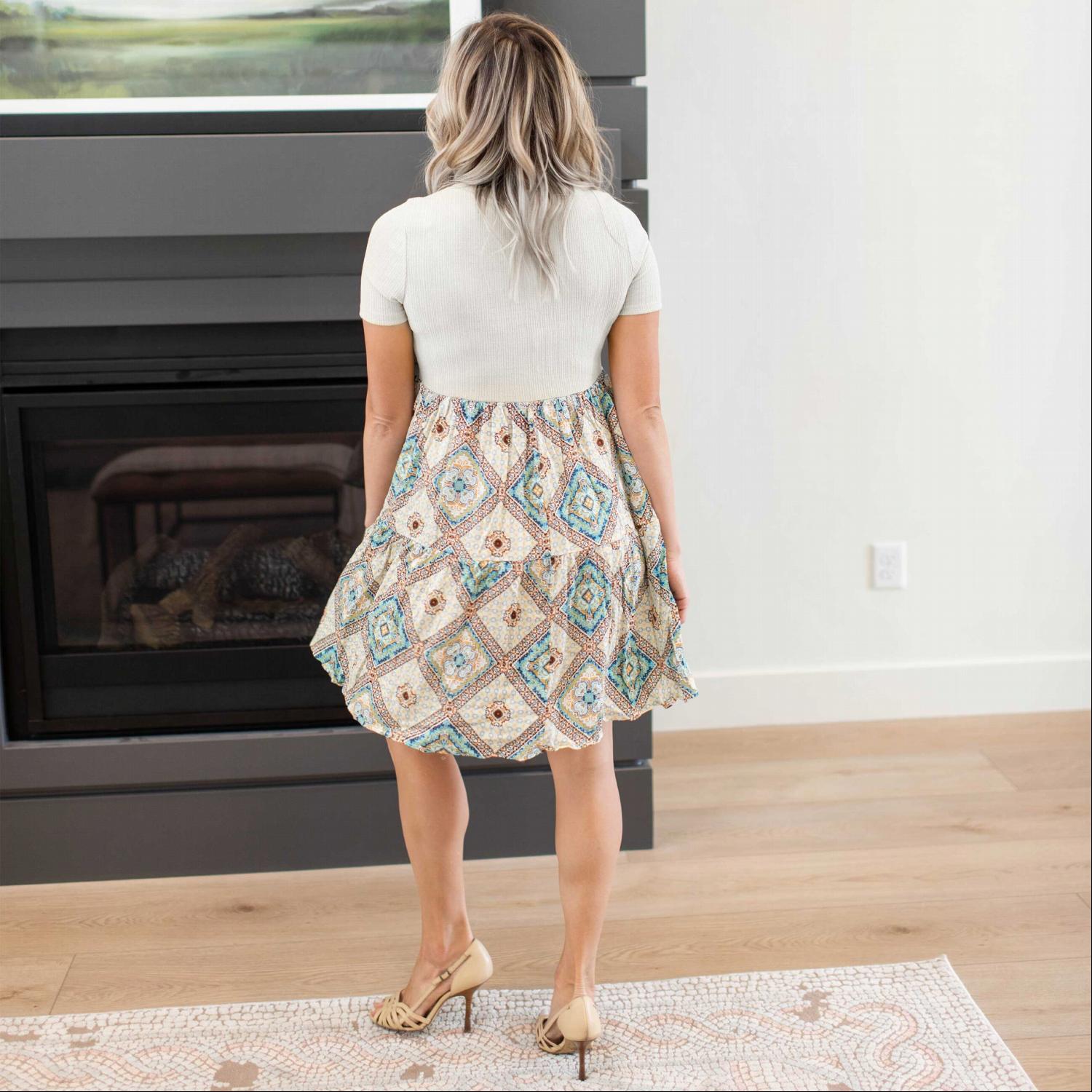 A stylish Printed Colorblock Tunic featuring a colorblocked design, short sleeves, and a fun print at the bottom, perfect for summer wear.