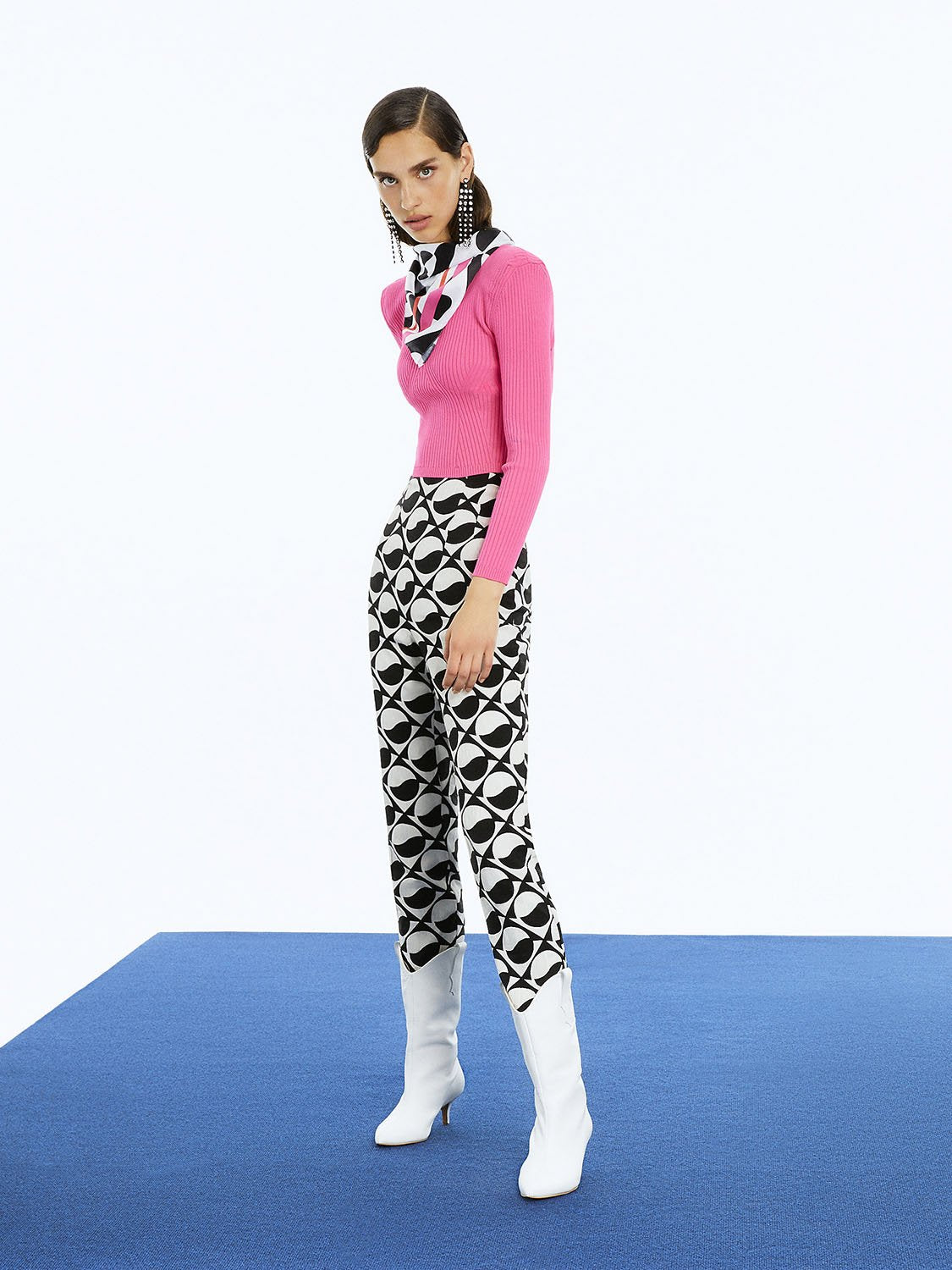 Stylish Printed High-Waisted Pants featuring a monochrome pattern with red and fuchsia accents, designed for a chic look.