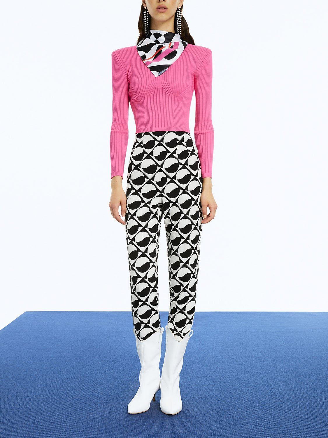 Stylish Printed High-Waisted Pants featuring a monochrome pattern with red and fuchsia accents, designed for a chic look.