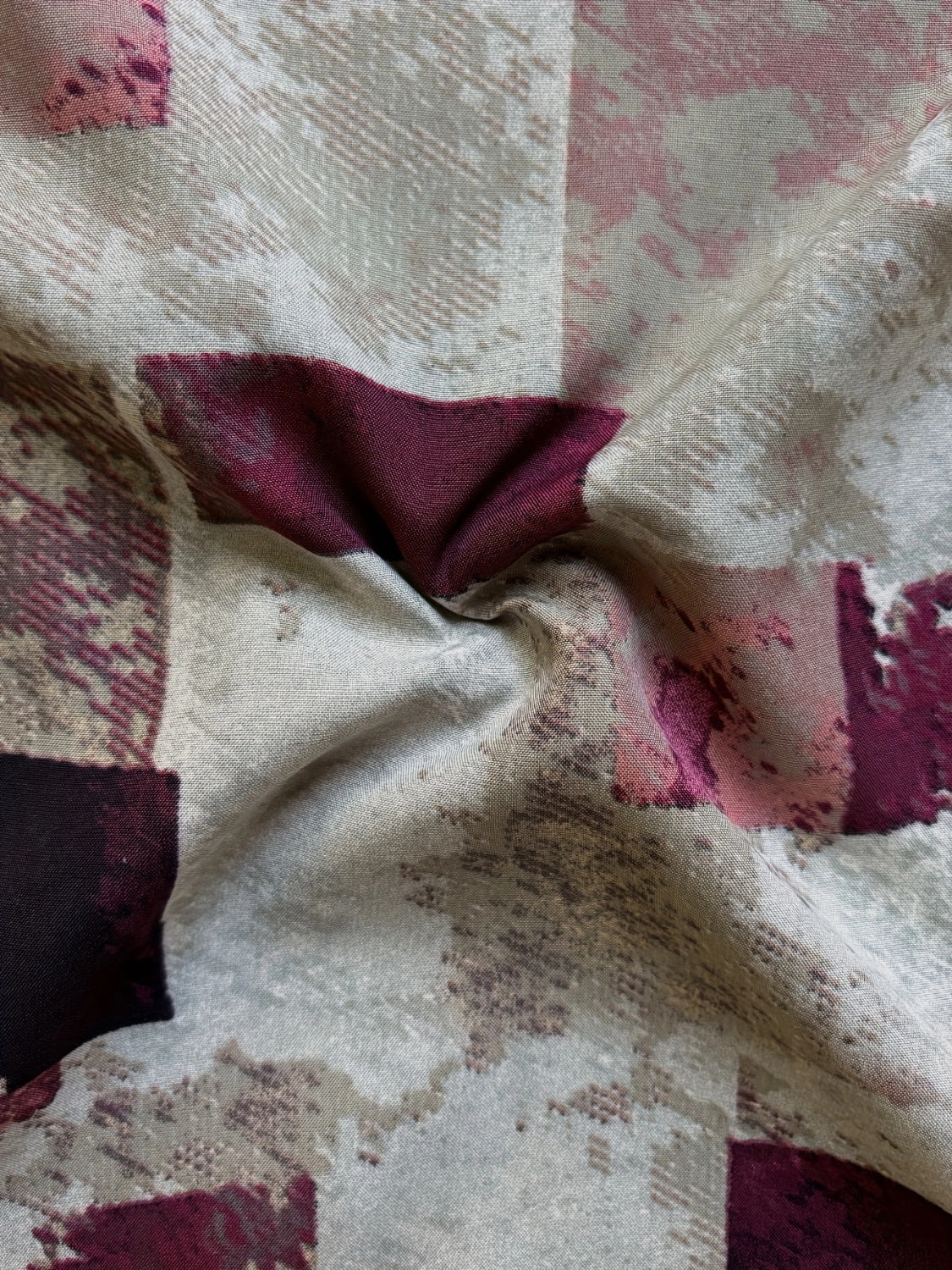 A stylish Printed Notched Short Sleeve Blouse featuring a chic neckline and short sleeves, made from a soft polyester blend.