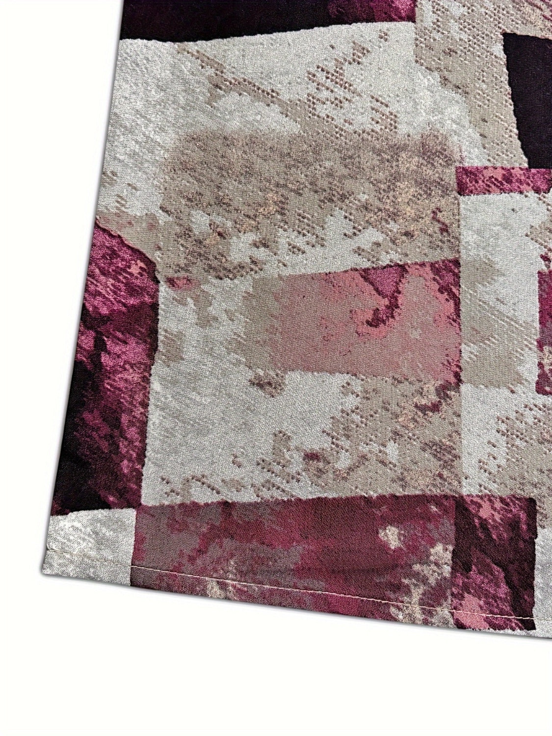 A stylish Printed Notched Short Sleeve Blouse featuring a chic neckline and short sleeves, made from a soft polyester blend.