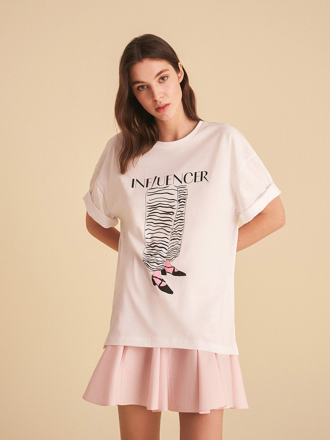 A vibrant Printed Oversize T-shirt featuring a digital collage design with hues of pink and artistic patterns, made from 100% cotton.