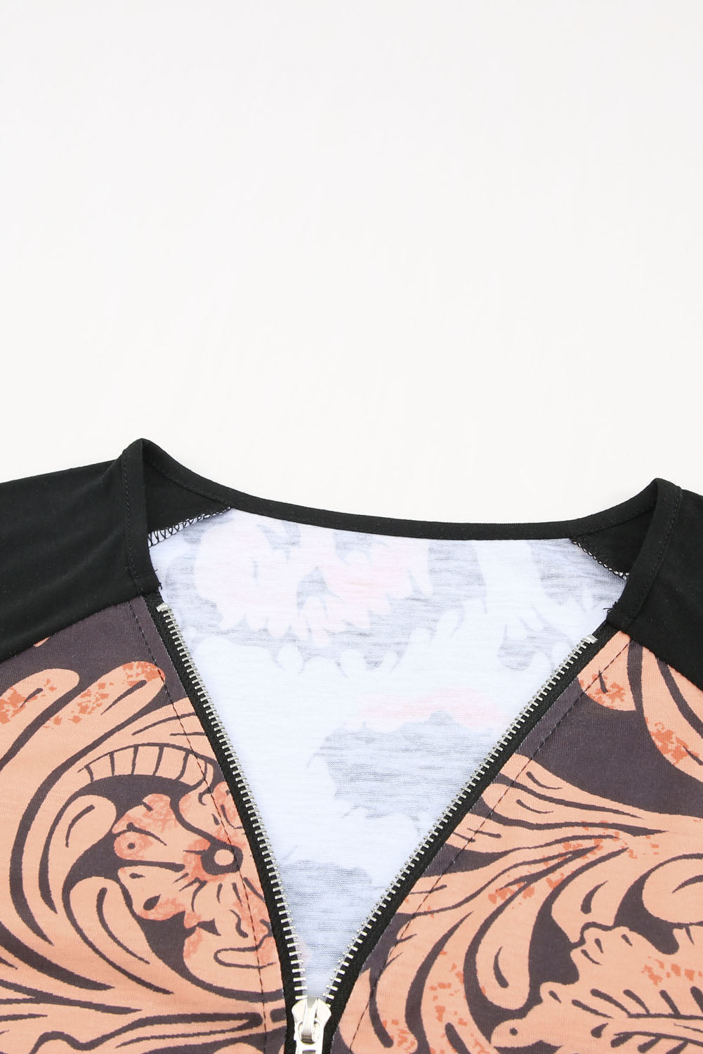A stylish Printed Zip-Collar Short Raglan Sleeve Tee featuring a unique print, zip collar, and short sleeves, perfect for casual wear.