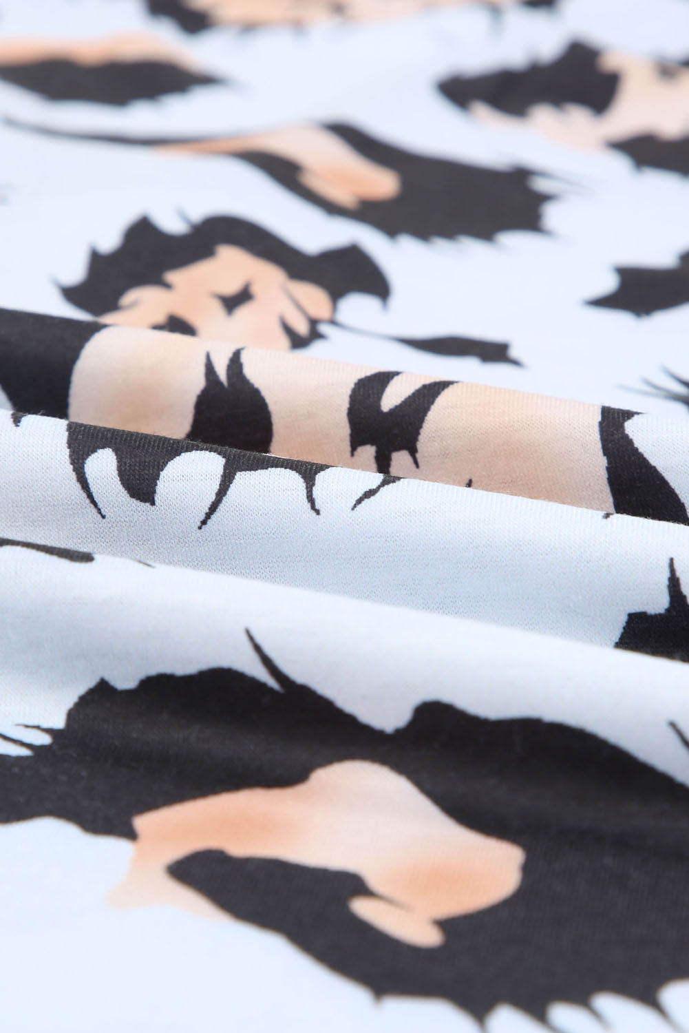 A stylish Printed Zip-Collar Short Raglan Sleeve Tee featuring a unique print, zip collar, and short sleeves, perfect for casual wear.