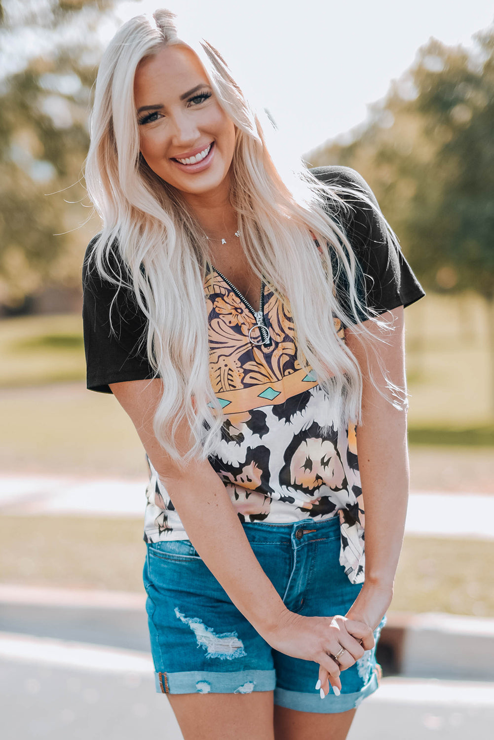 A stylish Printed Zip-Collar Short Raglan Sleeve Tee featuring a unique print, zip collar, and short sleeves, perfect for casual wear.