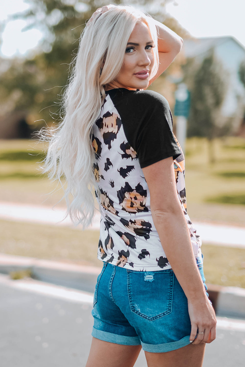 A stylish Printed Zip-Collar Short Raglan Sleeve Tee featuring a unique print, zip collar, and short sleeves, perfect for casual wear.