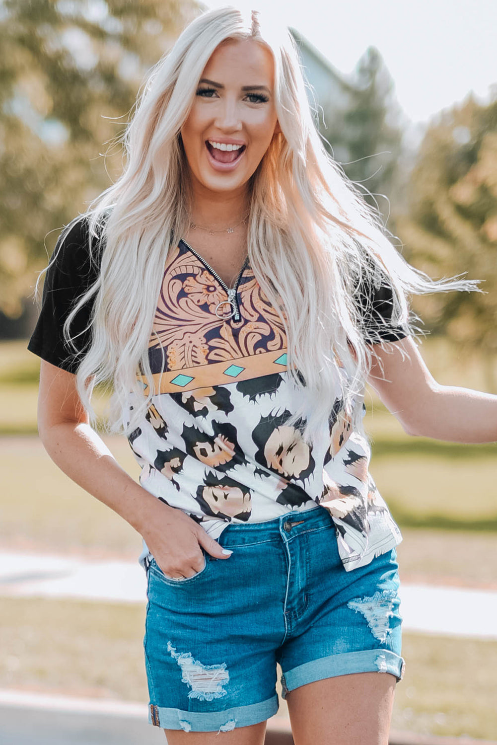 A stylish Printed Zip-Collar Short Raglan Sleeve Tee featuring a unique print, zip collar, and short sleeves, perfect for casual wear.