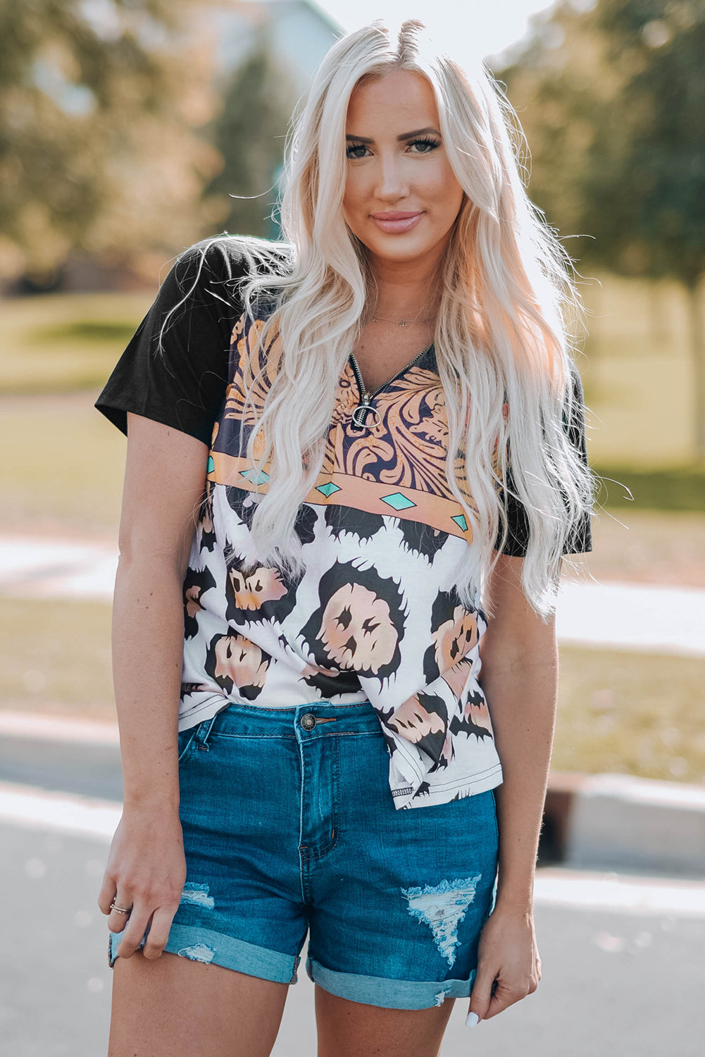 A stylish Printed Zip-Collar Short Raglan Sleeve Tee featuring a unique print, zip collar, and short sleeves, perfect for casual wear.