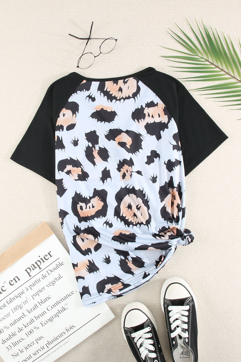 A stylish Printed Zip-Collar Short Raglan Sleeve Tee featuring a unique print, zip collar, and short sleeves, perfect for casual wear.