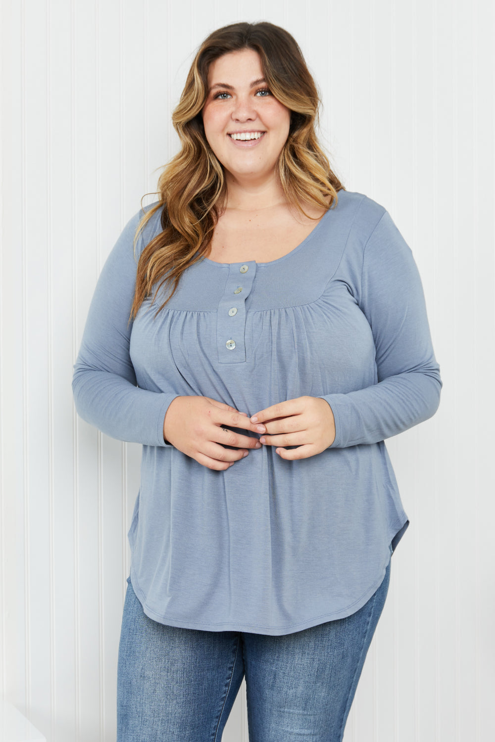 A stylish Quarter-Button Scoop Neck Tunic Top in a solid color, featuring long sleeves and a flattering scoop neckline, perfect for casual wear.